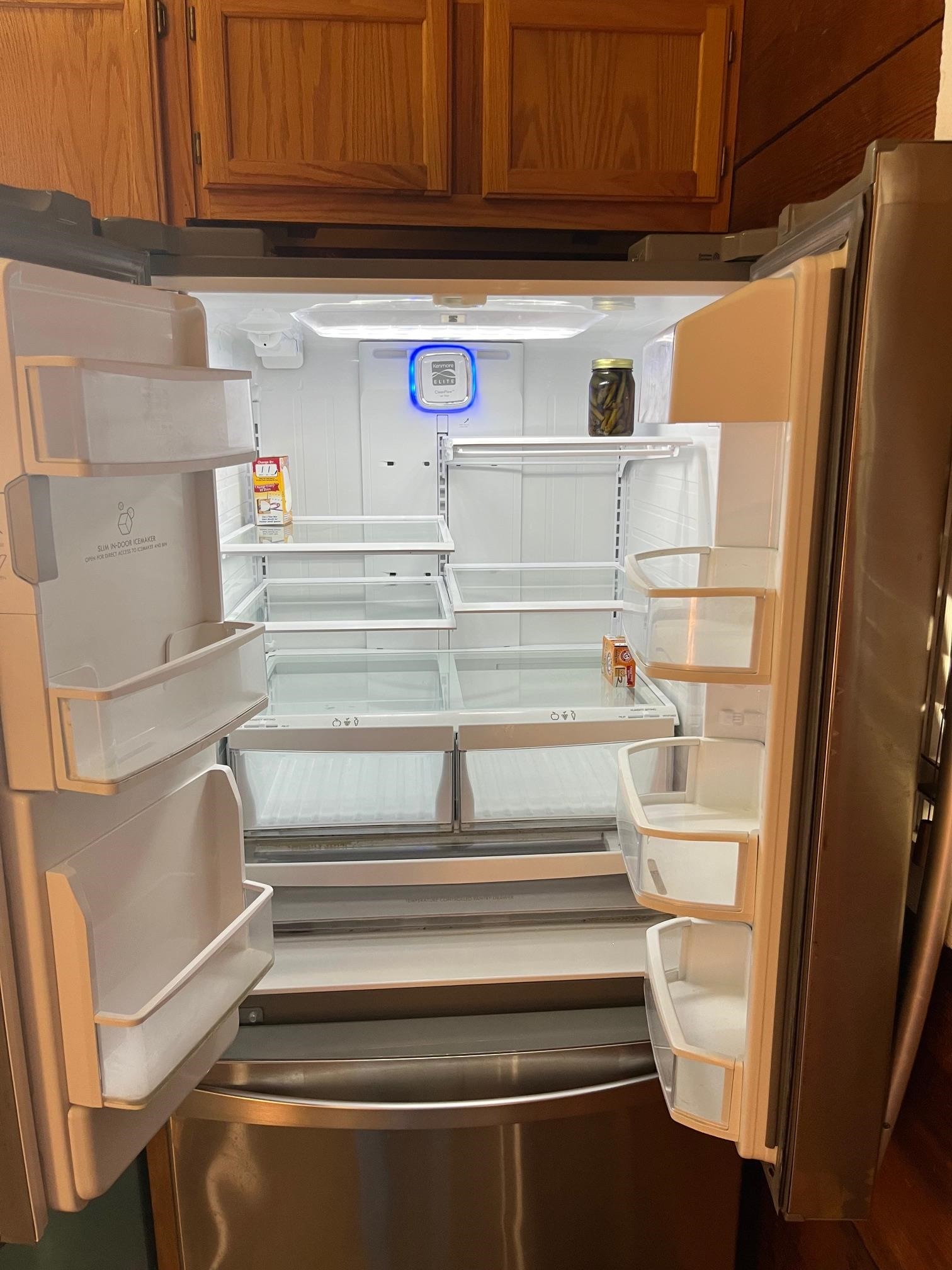 4161 Lucy Road Millington, TN 38053 - Photo 11 of 24 Kitchen view of refrigerator and wood finish cabinetry