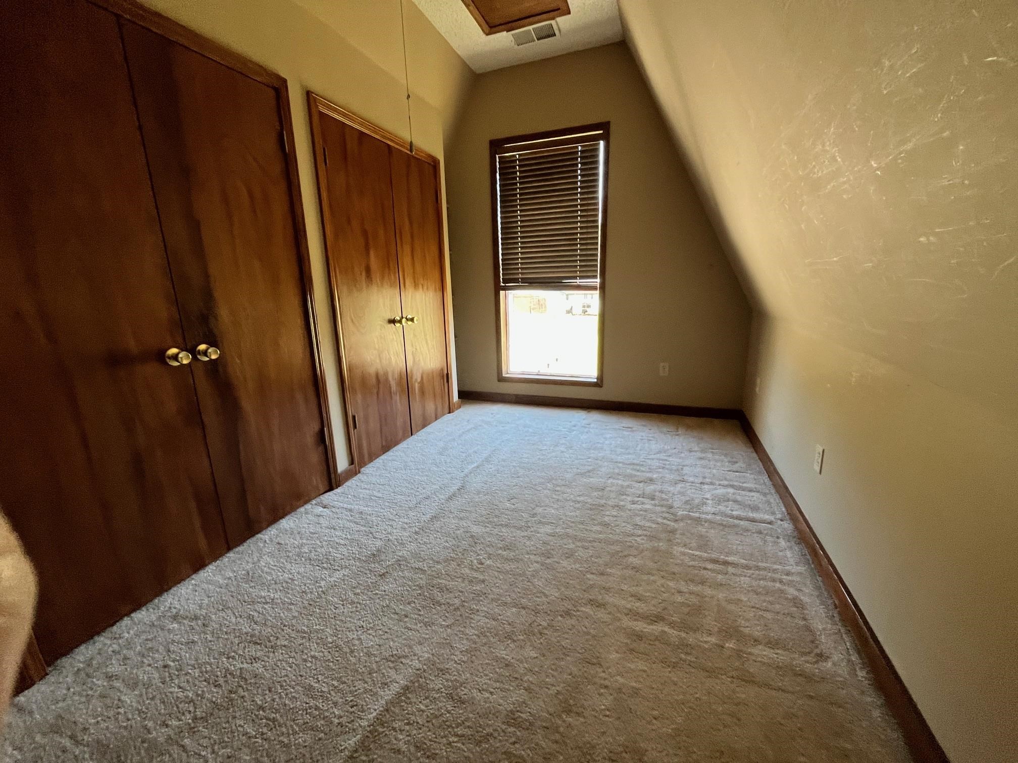 4161 Lucy Road Millington, TN 38053 - Photo 16 of 24 Unfurnished bedroom with two closets and carpet flooring