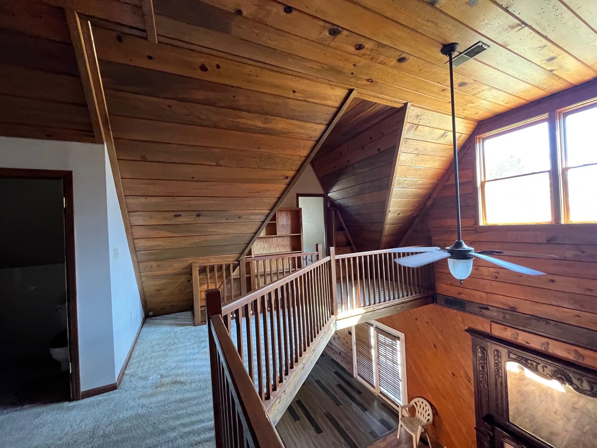 4161 Lucy Road Millington, TN 38053 - Photo 21 of 24 Stairway with wood ceiling, wood walls, ceiling fan, and wood finished floors