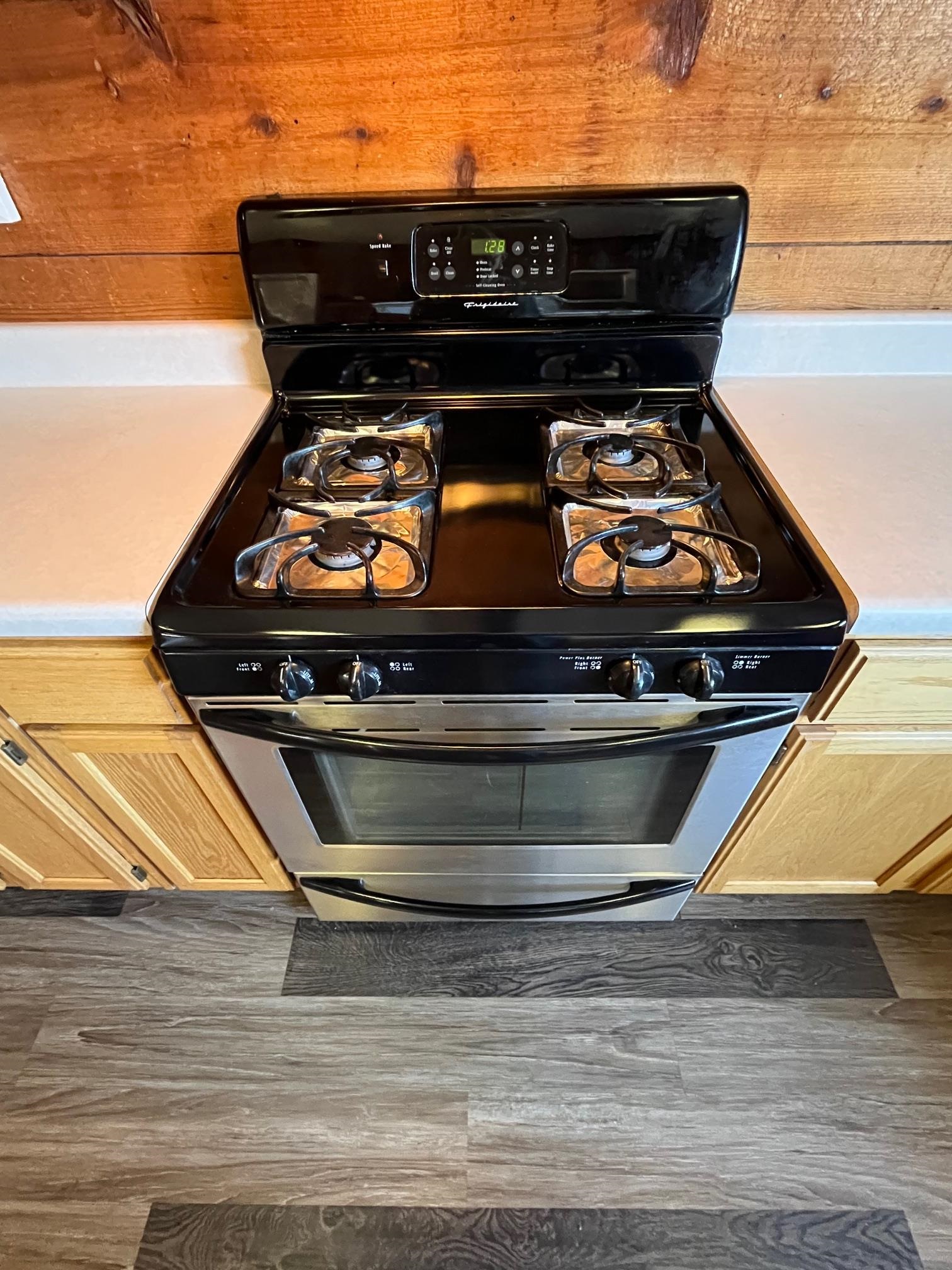 4161 Lucy Road Millington, TN 38053 - Photo 10 of 24 Kitchen view of light countertops, stainless steel range with gas stovetop, and light wood finish cabinetry