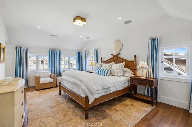 a bed room with a bed and a chandelier