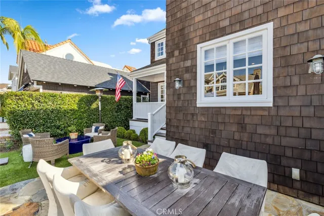 a view of a patio with couches chairs and a potted plant