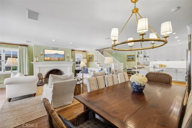 a living room with furniture a table and a fireplace