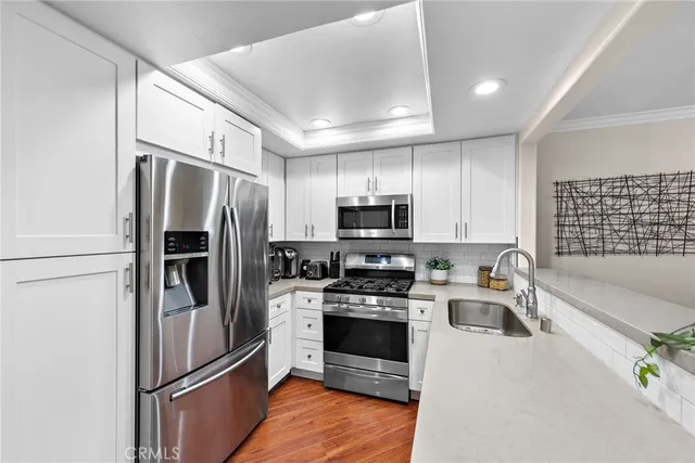 a bathroom with a sink and a large mirror