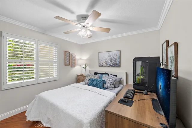 a bathroom with a granite countertop sink mirror vanity and toilet