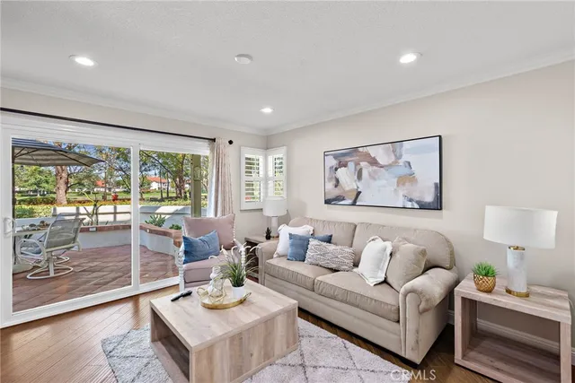 a living room with furniture fireplace and flat screen tv