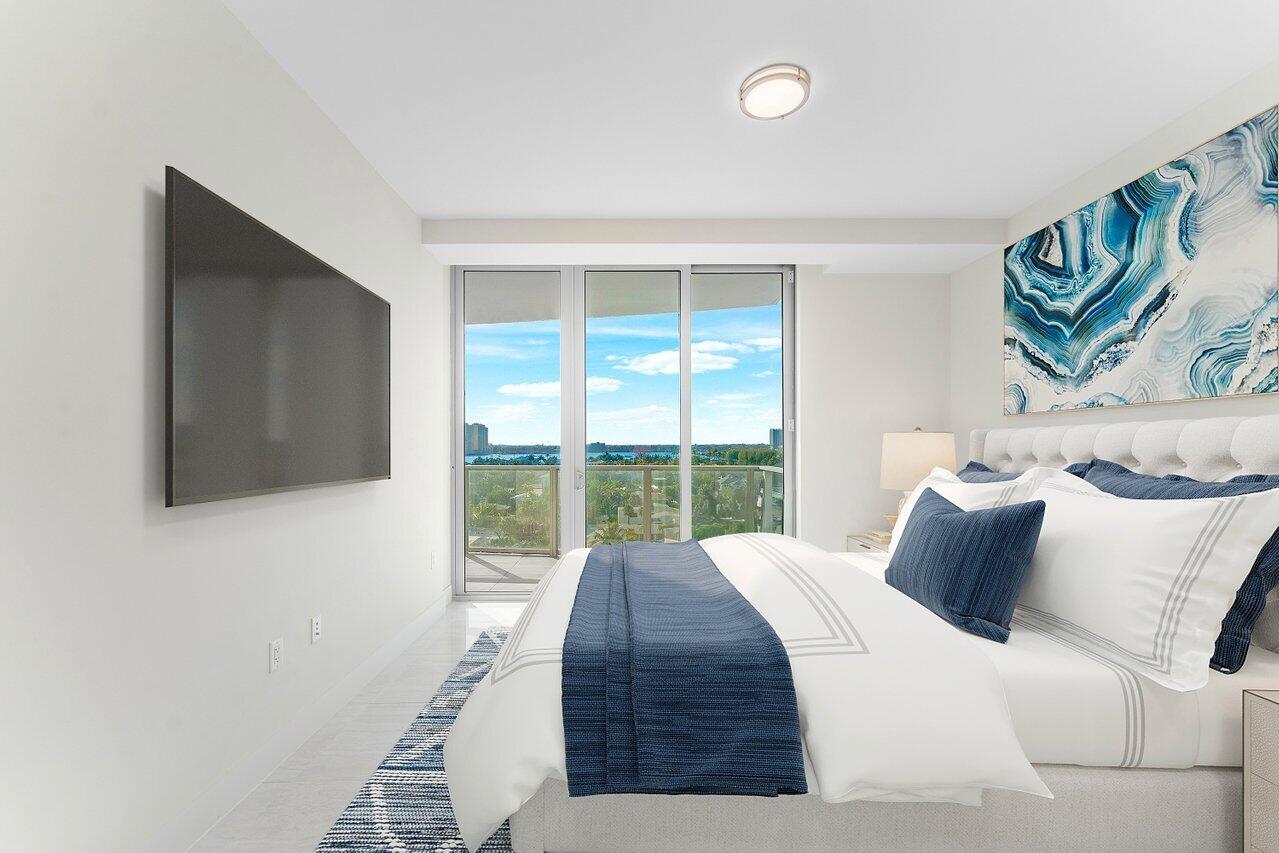 3100 North Ocean Drive, Unit P705 Riviera Beach, FL 33404 - Photo 19 of 98 a bedroom with a bed and a flat screen tv