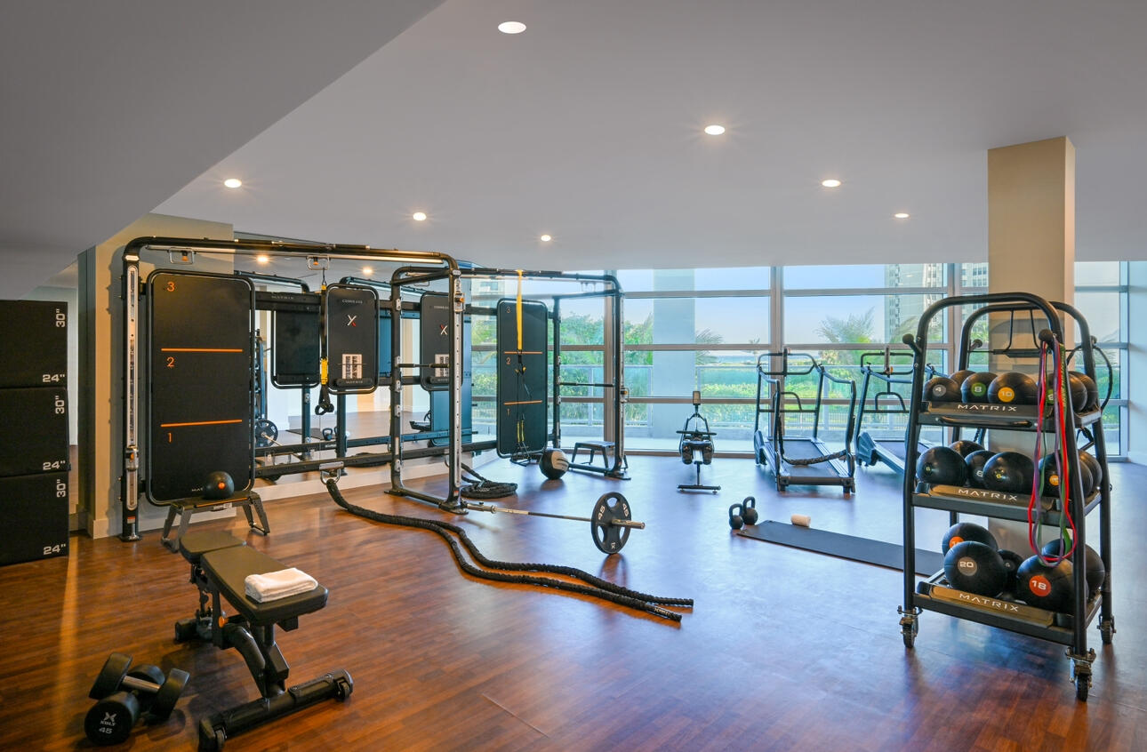 3100 North Ocean Drive, Unit P705 Riviera Beach, FL 33404 - Photo 63 of 98 a view of a room with gym equipment and floor to ceiling window