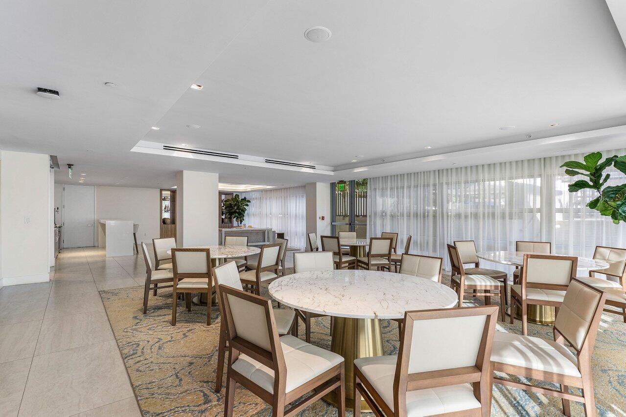 3100 North Ocean Drive, Unit P705 Riviera Beach, FL 33404 - Photo 83 of 98 a view of a dining room with furniture and wooden floor
