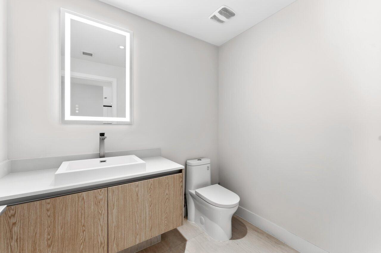 3100 North Ocean Drive, Unit P705 Riviera Beach, FL 33404 - Photo 9 of 98 a bathroom with a sink and a toilet