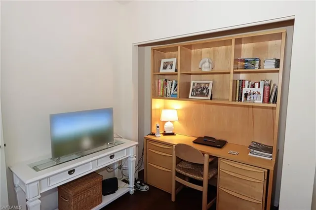 a view of workspace with flat screen tv