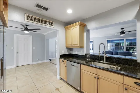 a kitchen with a sink and cabinets