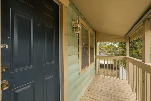 a view of a balcony with wooden floor