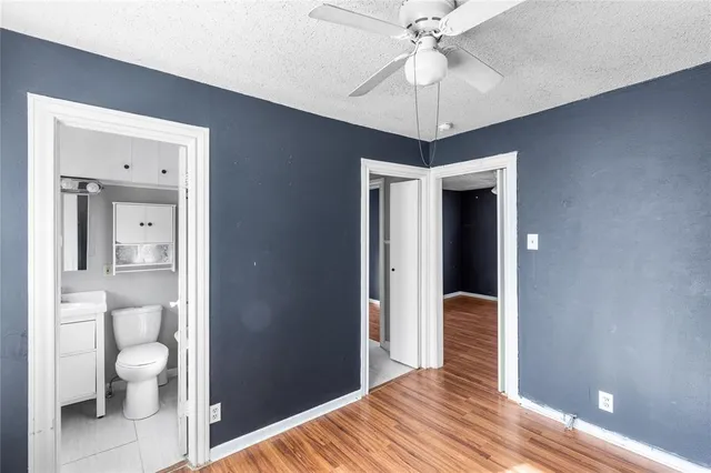 a view of a livingroom with wooden floor and a window