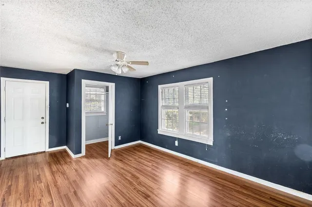 a view of cabinets a sink and a stove in a kitchen