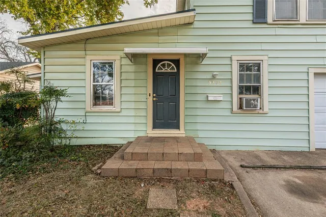 a front view of a house with garage