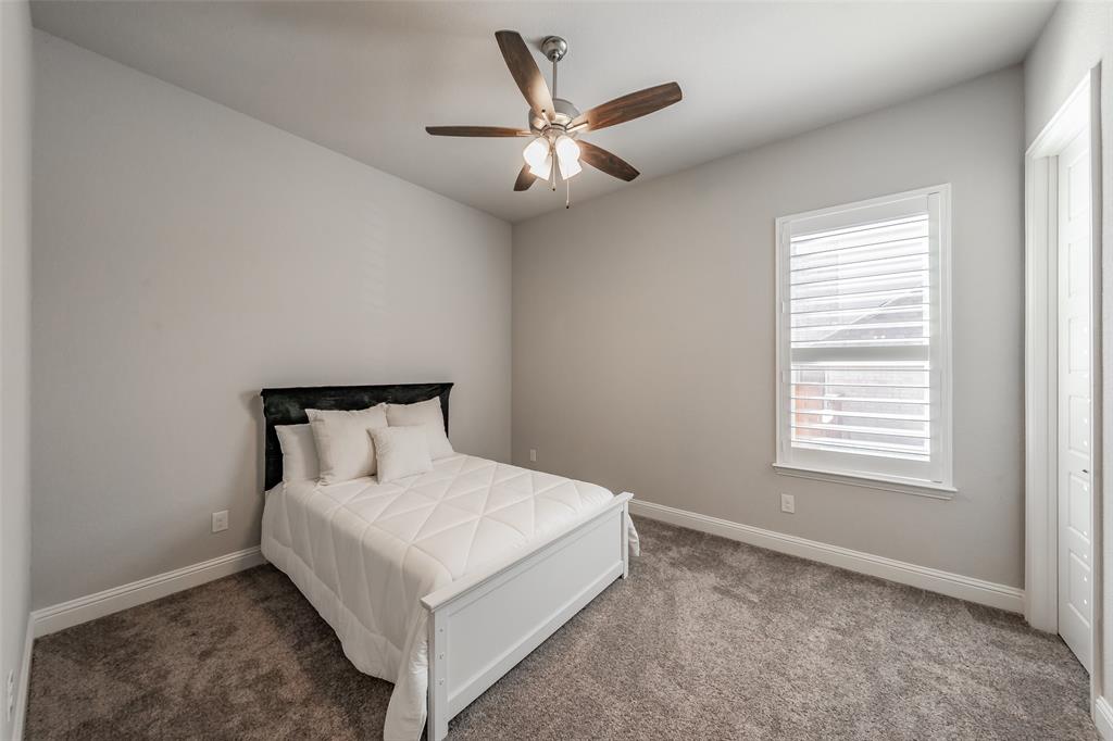 11609 Little Elm Creek Road Flower Mound, TX 76226 - Photo 18 of 40 a white bed sitting in a bedroom next to a window