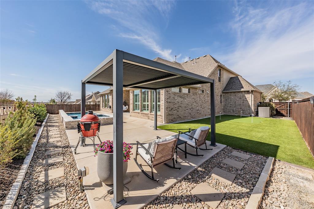 11609 Little Elm Creek Road Flower Mound, TX 76226 - Photo 35 of 40 a view of a backyard with sitting area