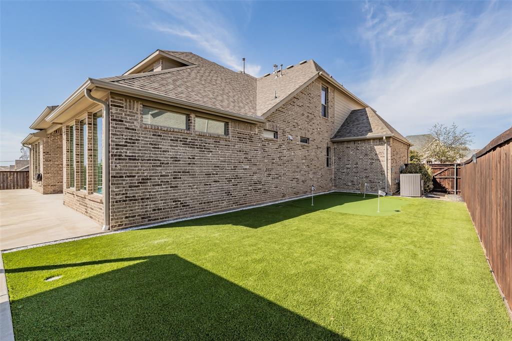 11609 Little Elm Creek Road Flower Mound, TX 76226 - Photo 36 of 40 a front view of a house with a garden