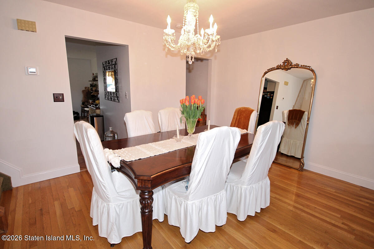 951 West Fingerboard Road Staten Island, NY 10304 - Photo 5 of 29 a view of a dining room with furniture and wooden floor