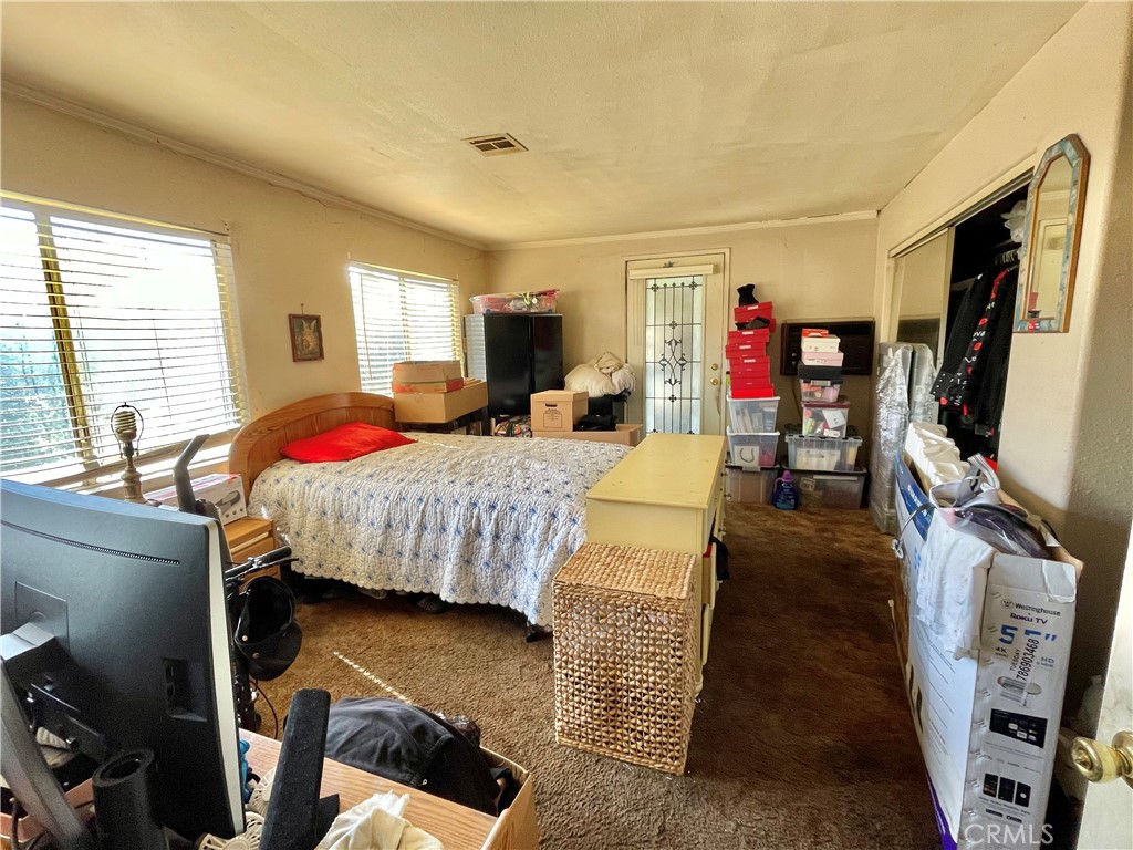 2525 Falling Leaf Avenue Rosemead, CA 91770 - Photo 11 of 28 a bedroom with a bed a flat screen tv and dresser