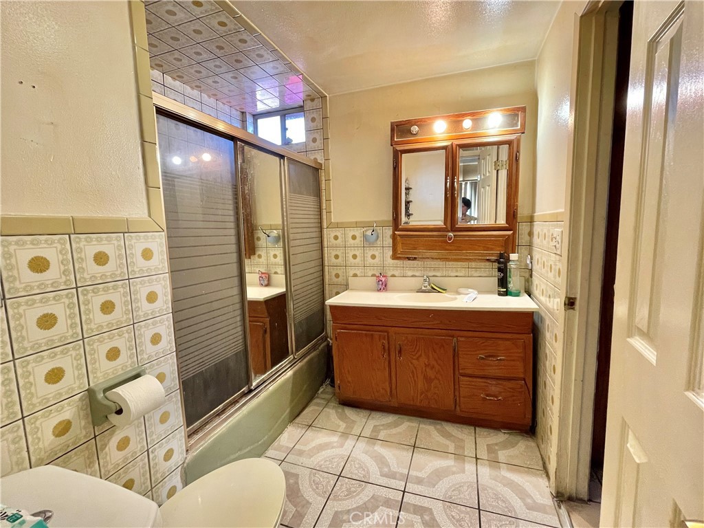 2525 Falling Leaf Avenue Rosemead, CA 91770 - Photo 15 of 28 a bathroom with a sink a vanity and mirror