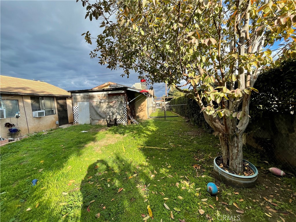2525 Falling Leaf Avenue Rosemead, CA 91770 - Photo 20 of 28 a view of a patio with table and chairs potted plants and large tree