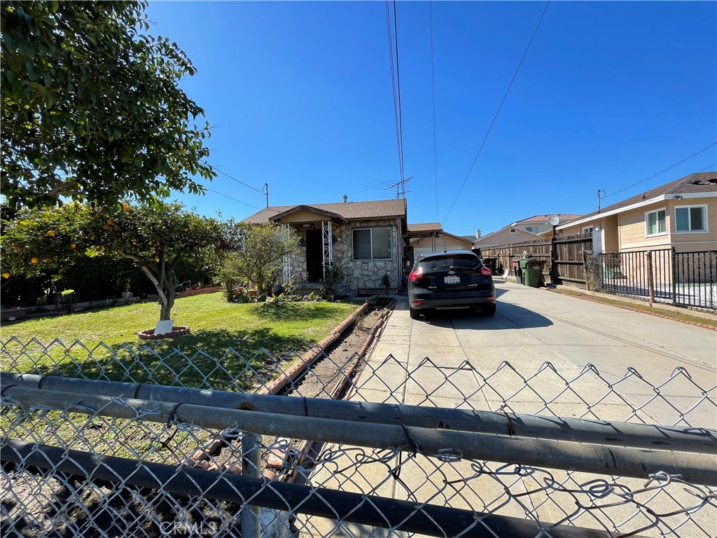 2525 Falling Leaf Avenue Rosemead, CA 91770 - Photo 5 of 28 a car parked in front of a wooden fence