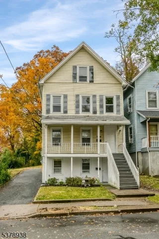 a front view of a house with a porch