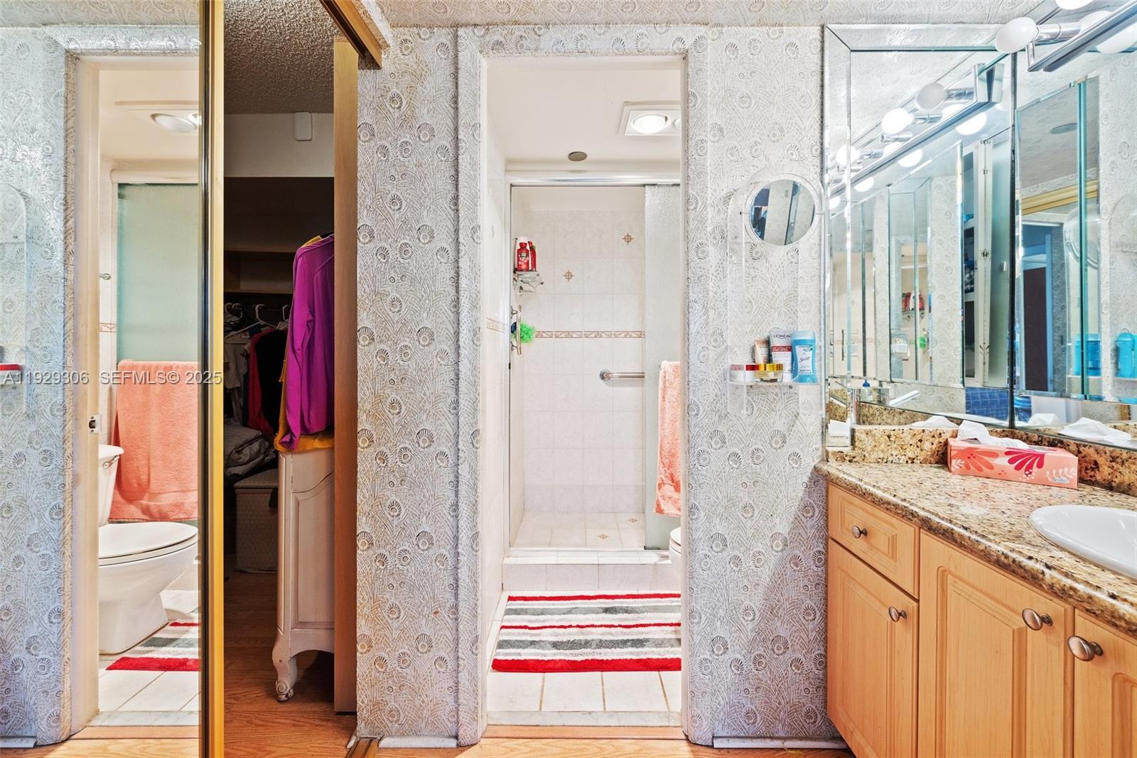 900 St Charles Place, Unit 419 Pembroke Pines, FL 33026 - Photo 21 of 27 a bathroom with a granite countertop shower and a sink