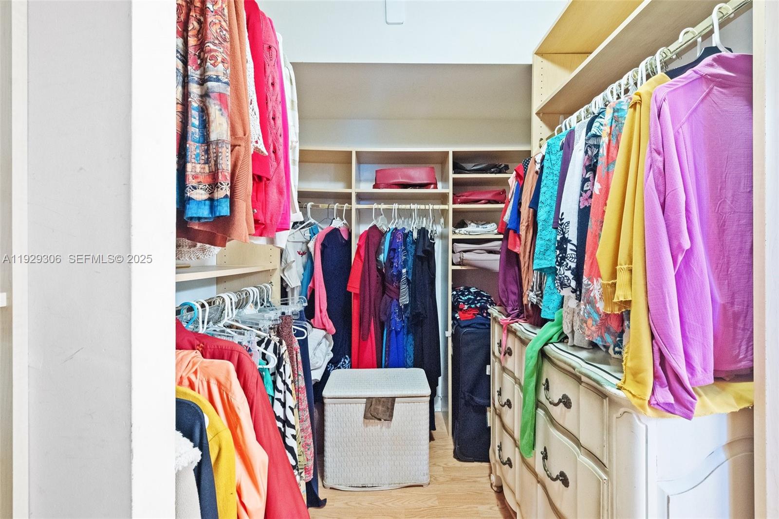 900 St Charles Place, Unit 419 Pembroke Pines, FL 33026 - Photo 22 of 27 a view of walk in closet with clothes