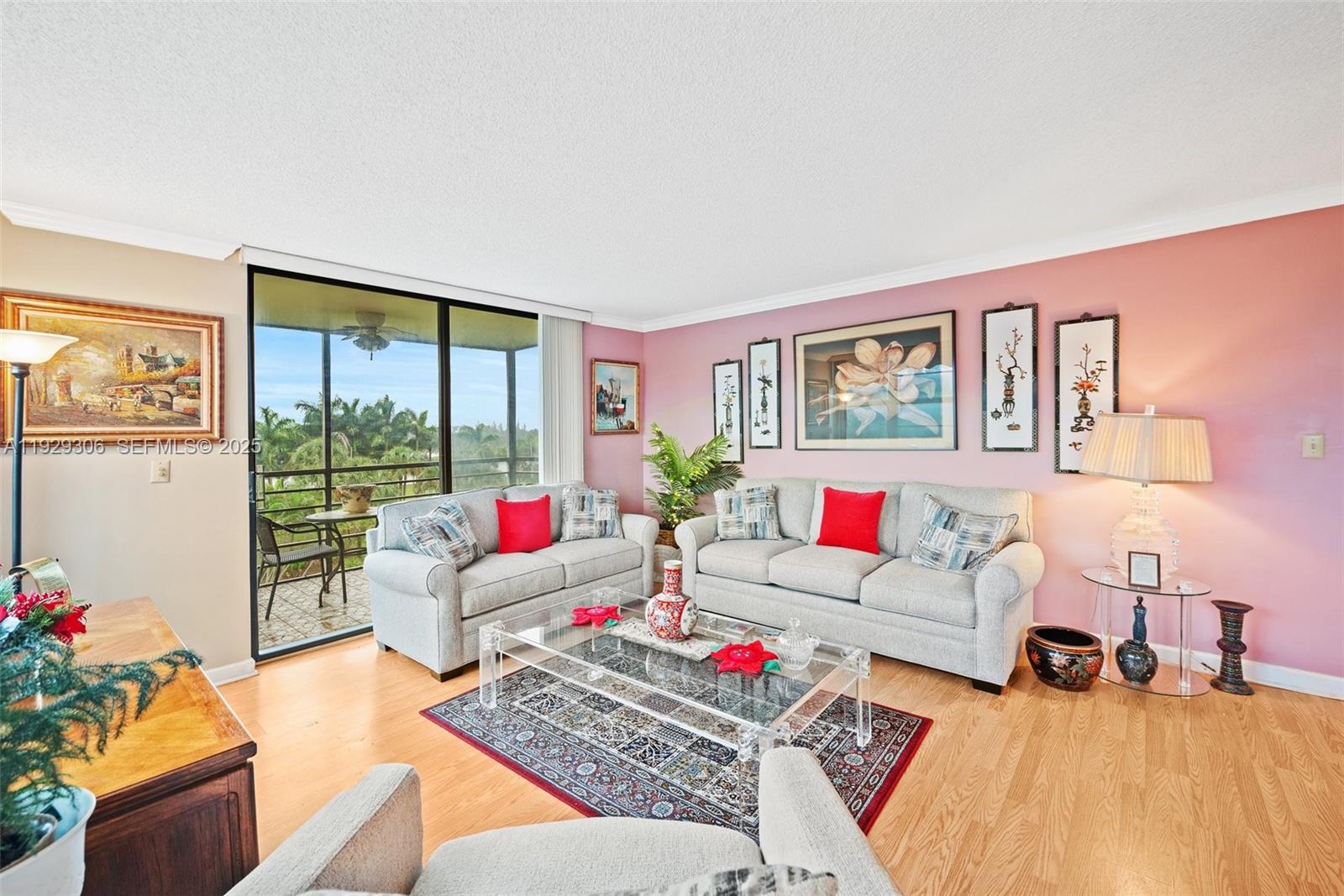 900 St Charles Place, Unit 419 Pembroke Pines, FL 33026 - Photo 9 of 27 a living room with furniture and a large window