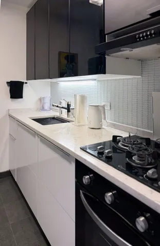 a kitchen with a sink and cabinets