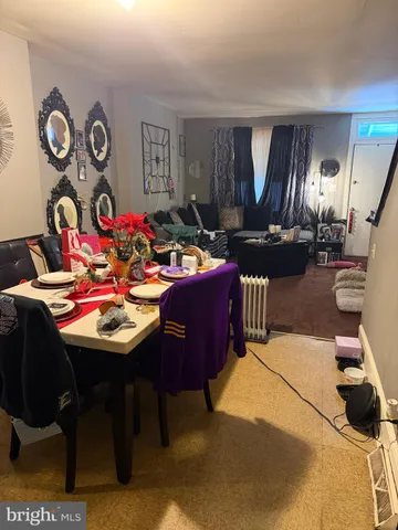 a dining room with a table and chairs