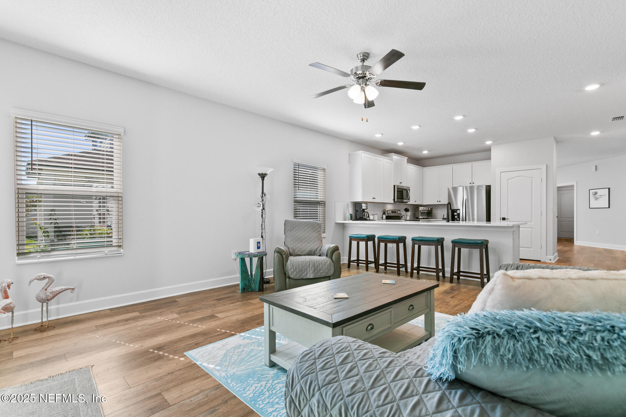 52 Falcon Ridge Road St. Augustine, FL 32084 - Photo 21 of 36 a living room with furniture kitchen view and a window