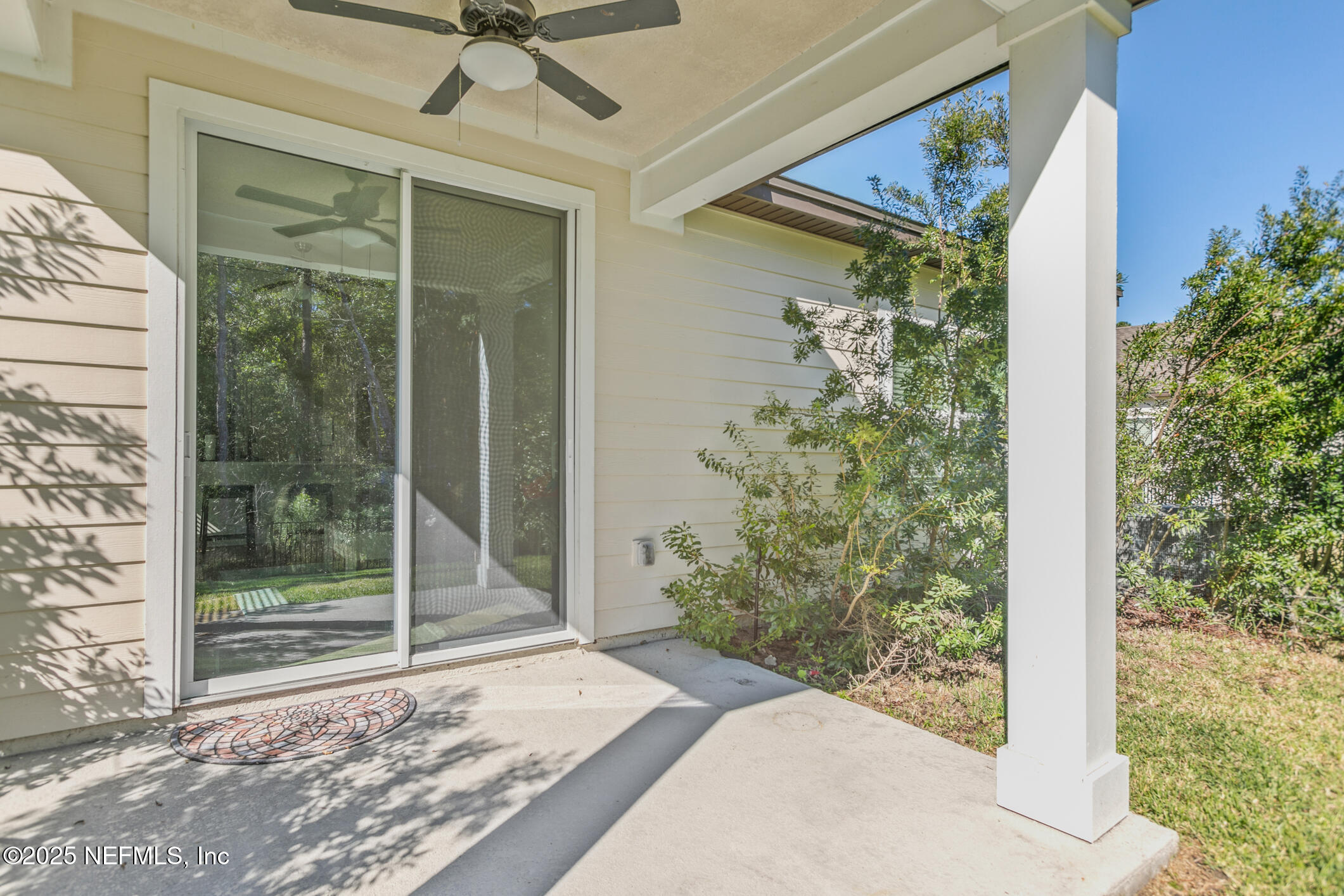 52 Falcon Ridge Road St. Augustine, FL 32084 - Photo 31 of 36 a view of a glass door with a porch