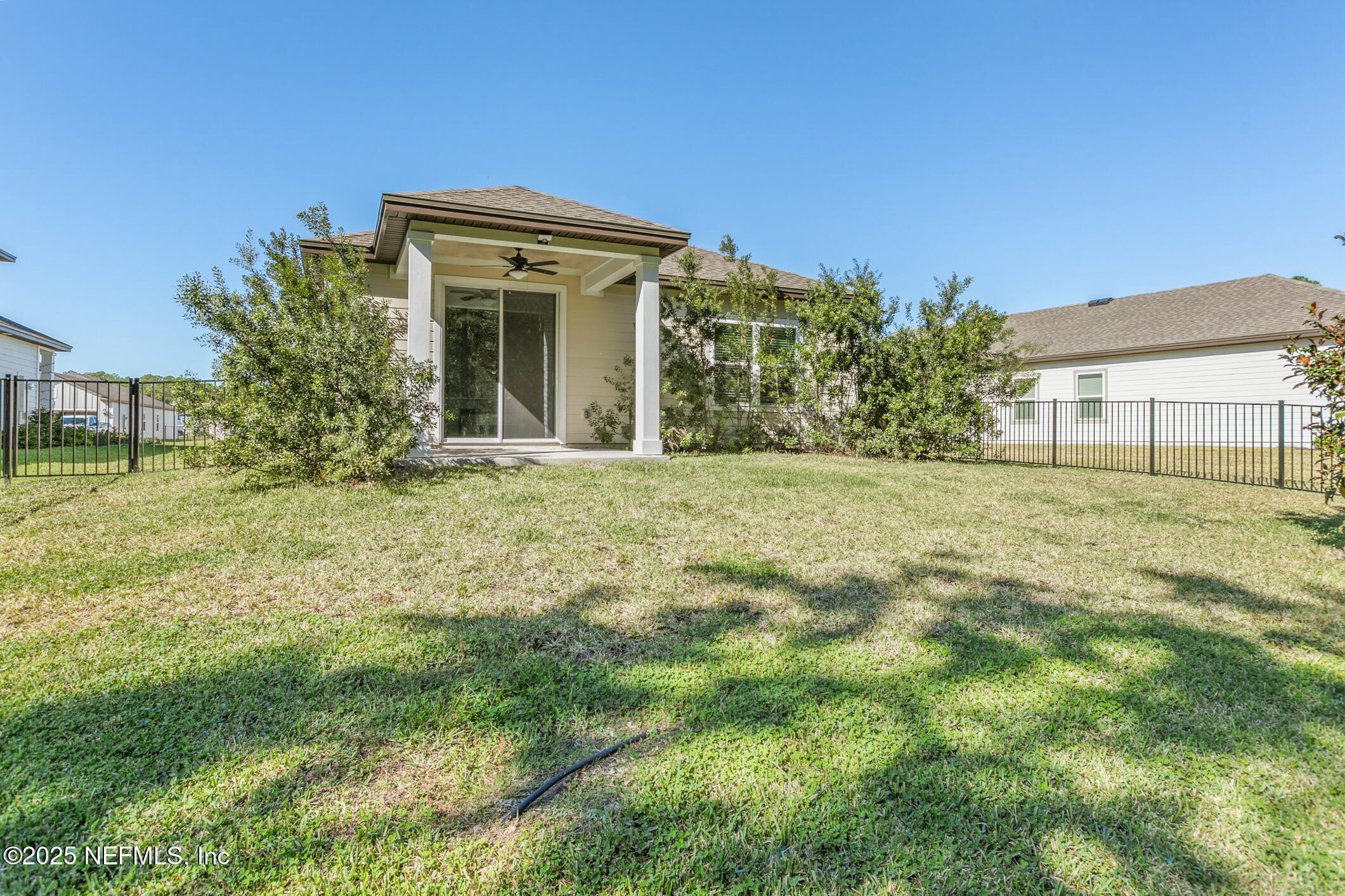 52 Falcon Ridge Road St. Augustine, FL 32084 - Photo 32 of 36 a front view of a house with a garden