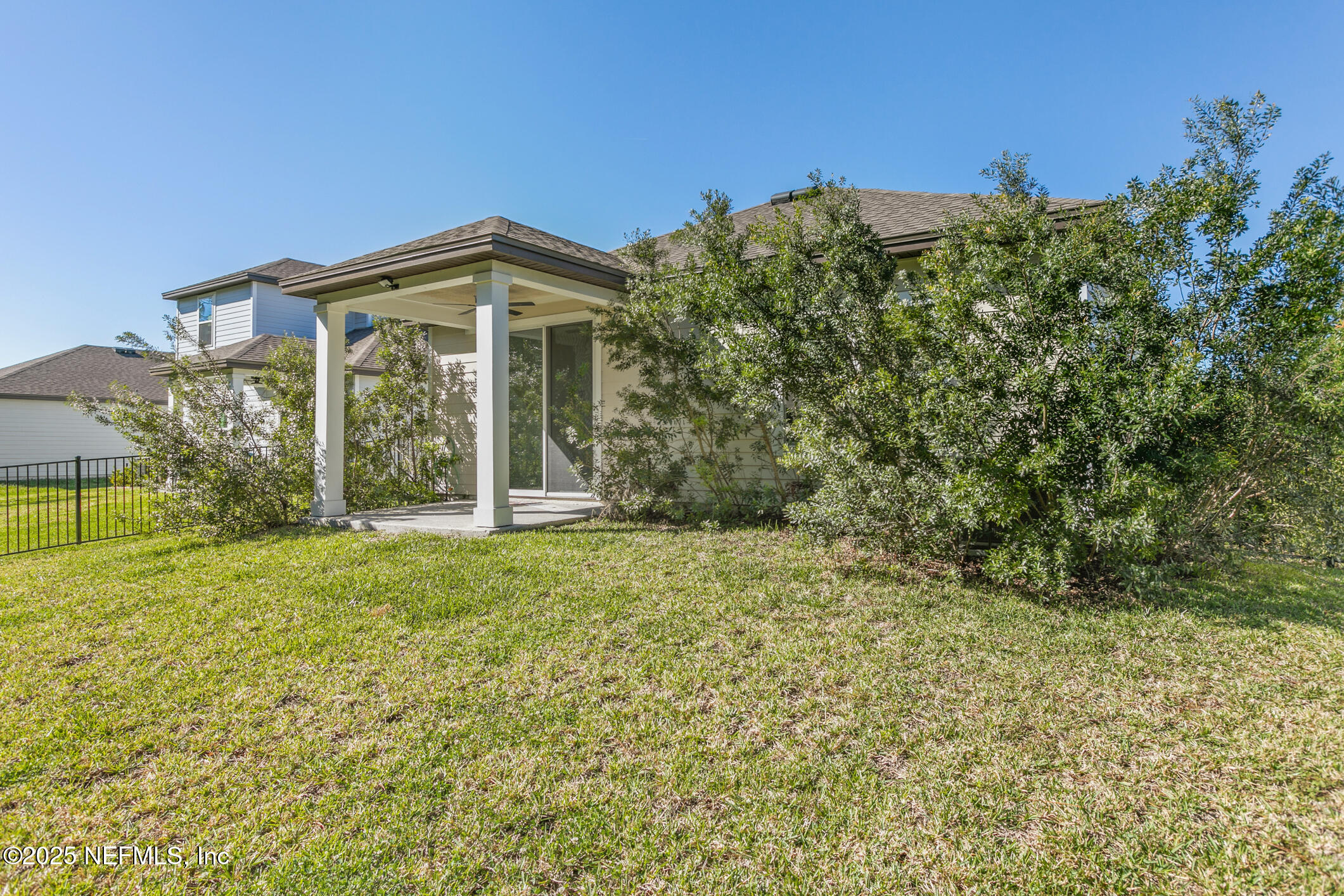 52 Falcon Ridge Road St. Augustine, FL 32084 - Photo 34 of 36 a view of a house with backyard and garden