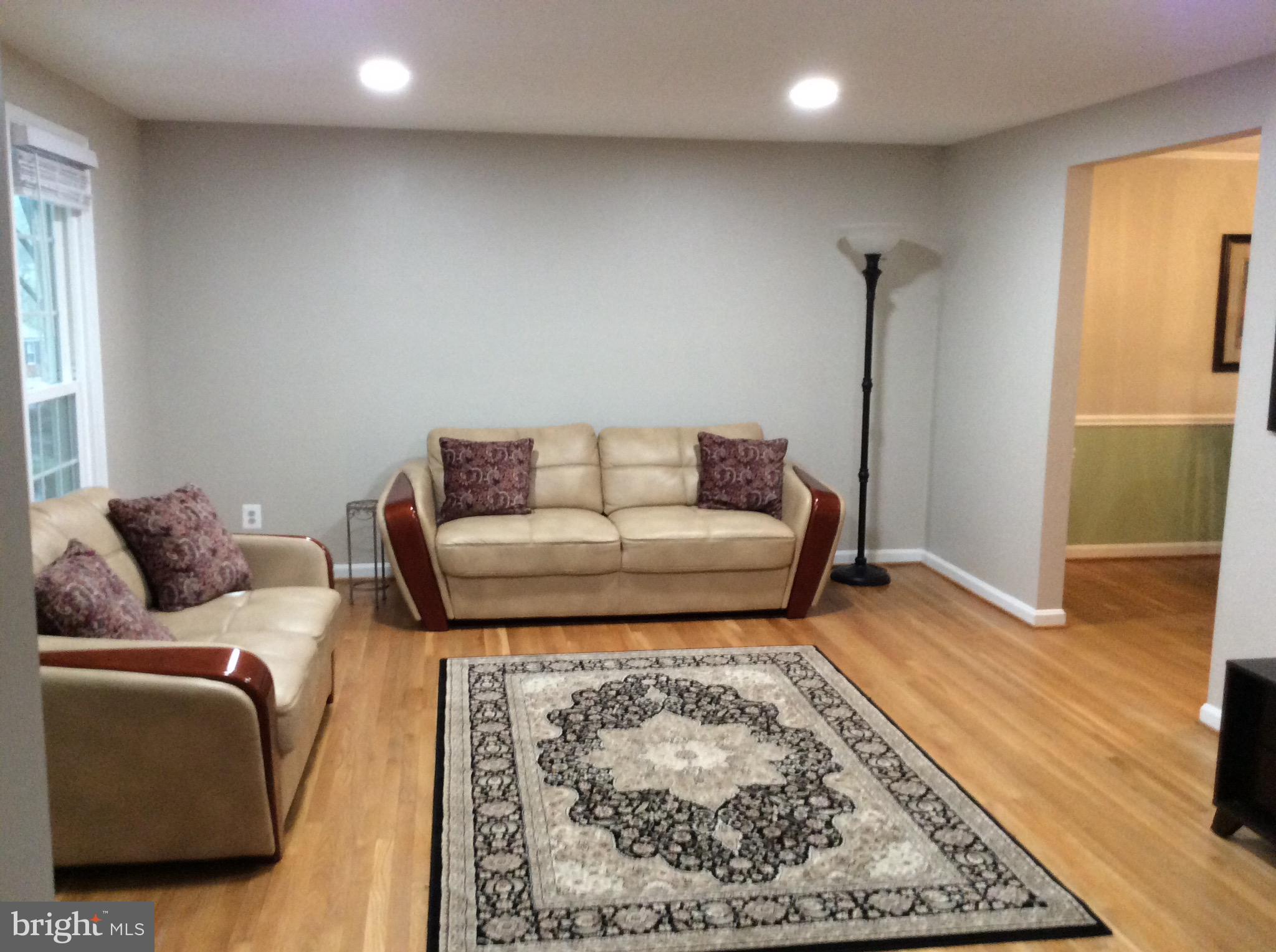 Spacious living room with recessed lighting