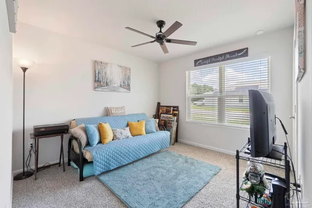 a living room with furniture and a window