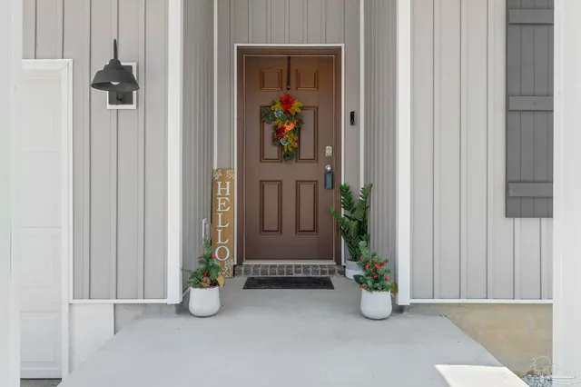 a view of an entryway with wooden floor