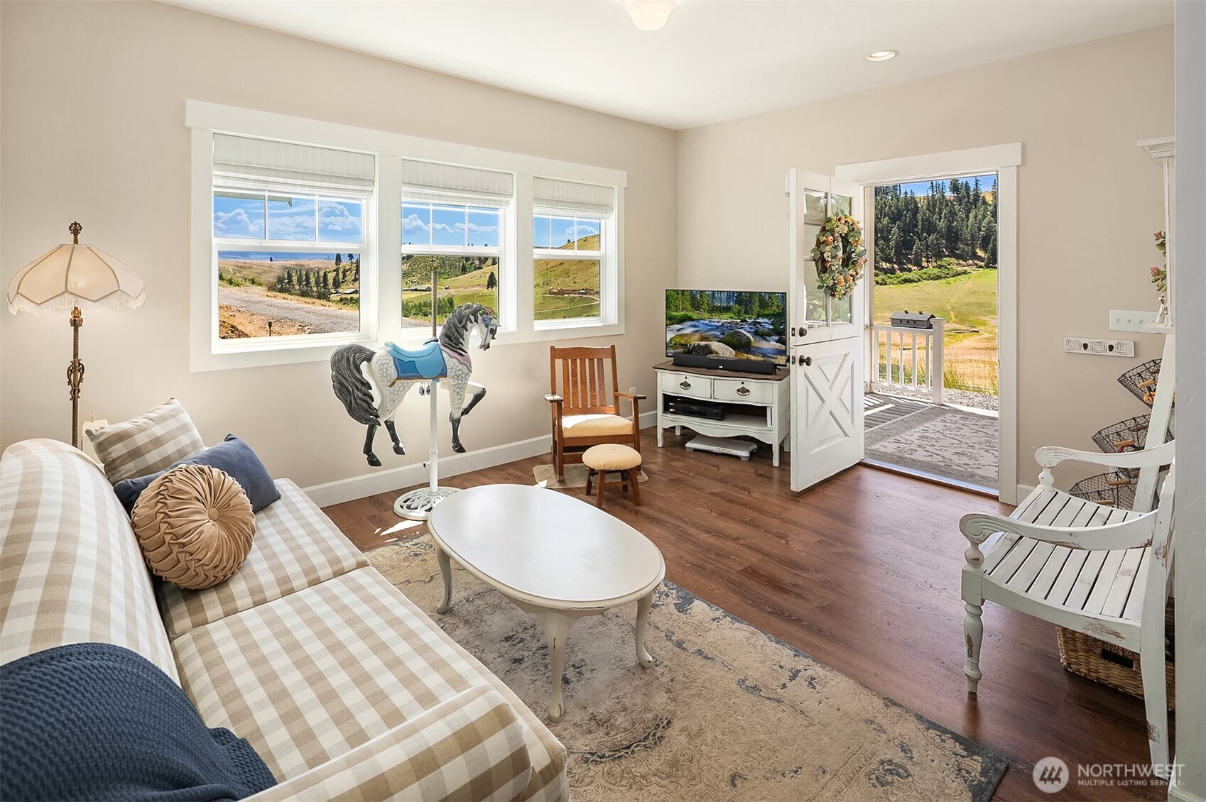 2080 Bettas Road Cle Elum, WA 98922 - Photo 5 of 31 a living room with furniture a large window and wooden floor