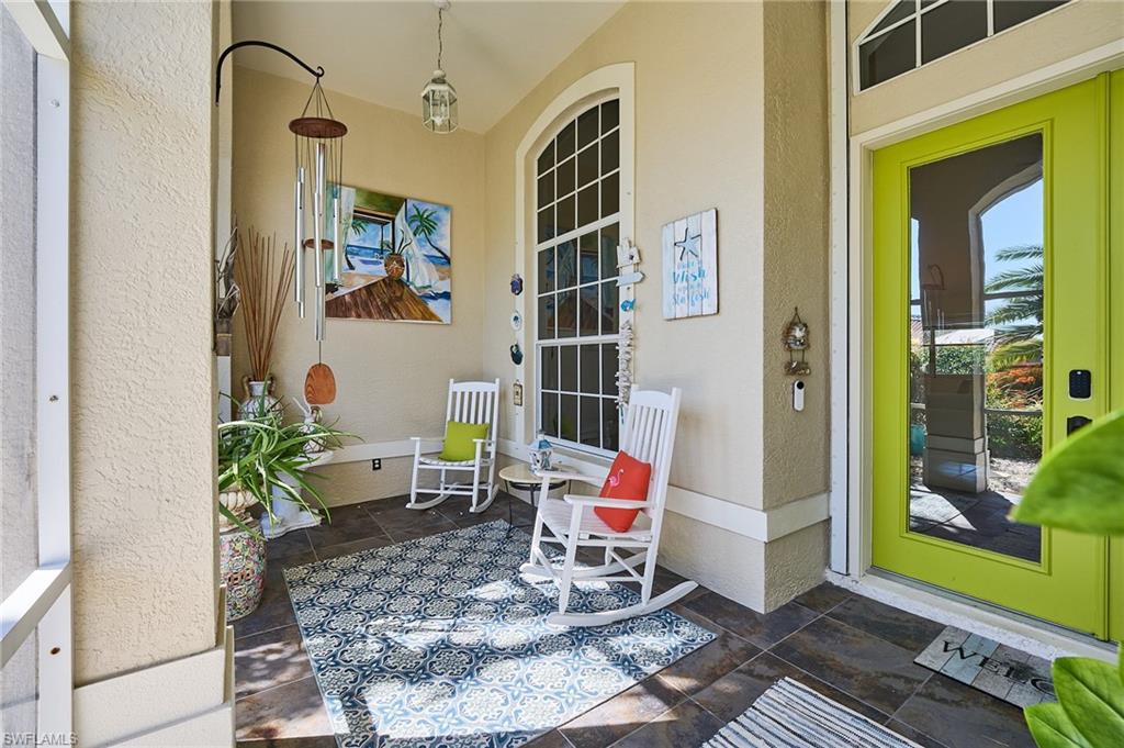 186 Muirfield Circle Naples, FL 34113 - Photo 29 of 36 a backyard of a house with outdoor seating