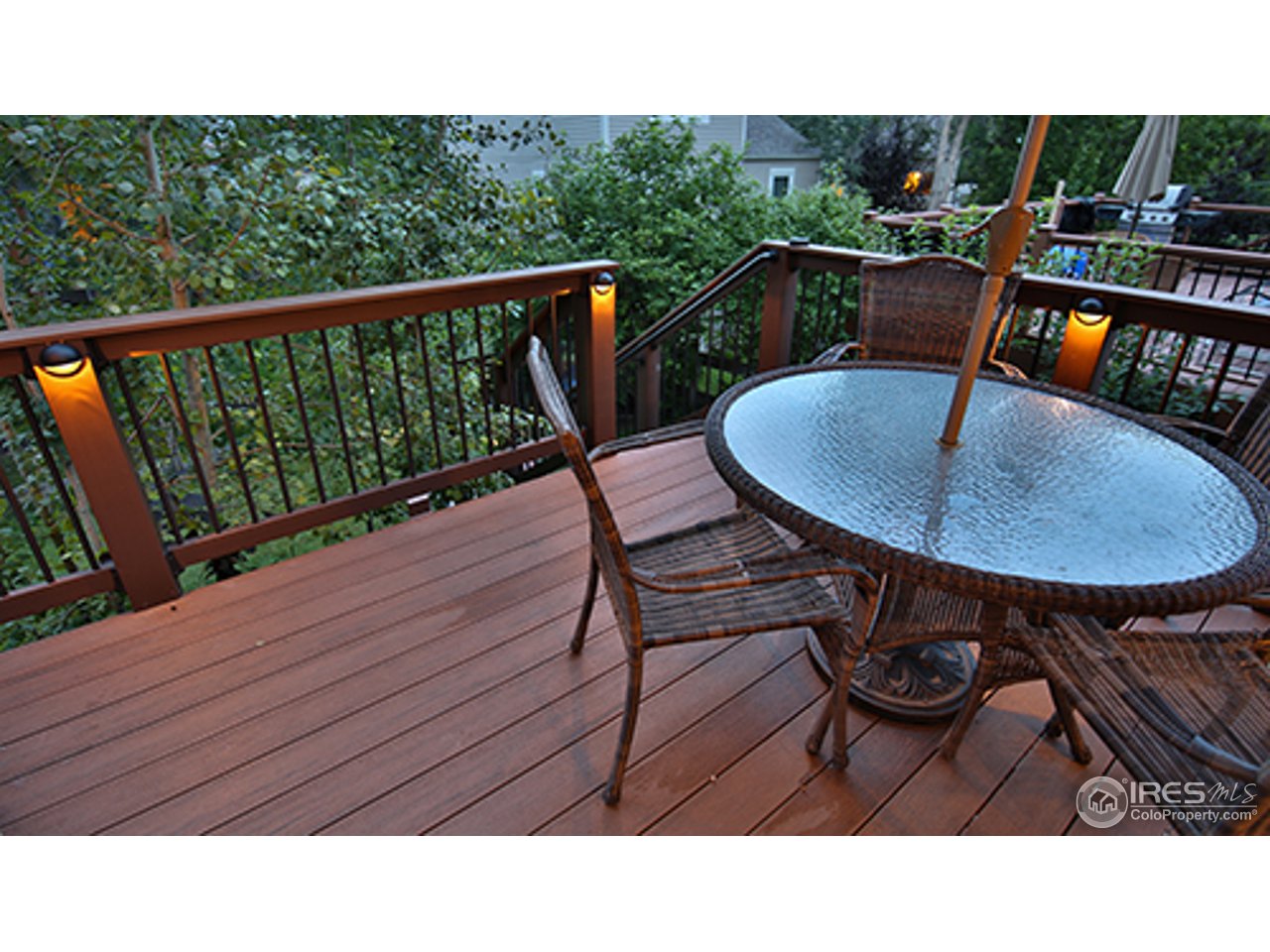 2445 Rim Drive Broomfield, CO 80020 - Photo 13 of 13 a balcony with table and chairs