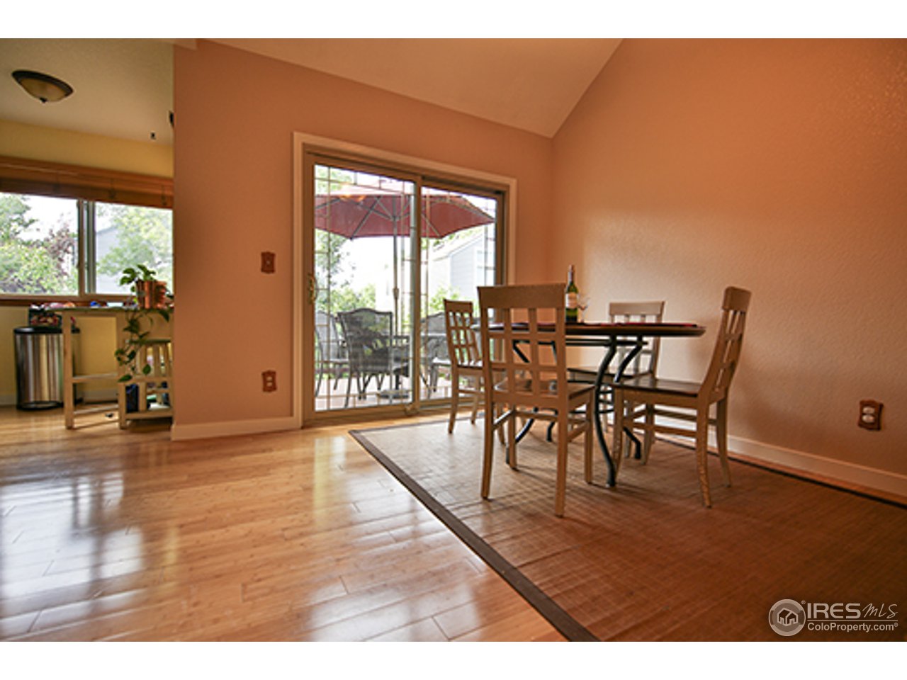 2445 Rim Drive Broomfield, CO 80020 - Photo 5 of 13 a view of a dining room with furniture and wooden floor