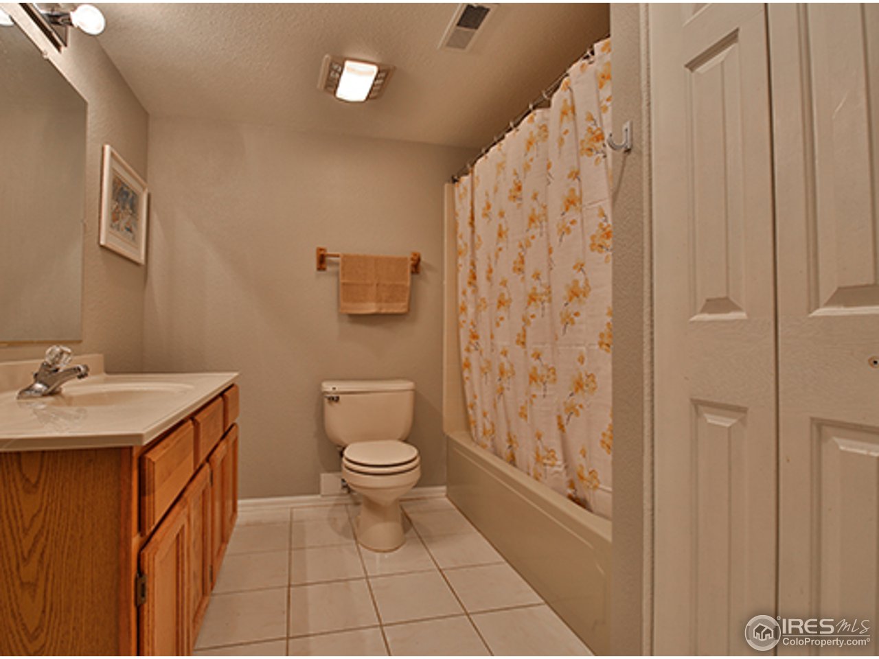 2445 Rim Drive Broomfield, CO 80020 - Photo 10 of 13 a bathroom with a toilet a sink and a shower
