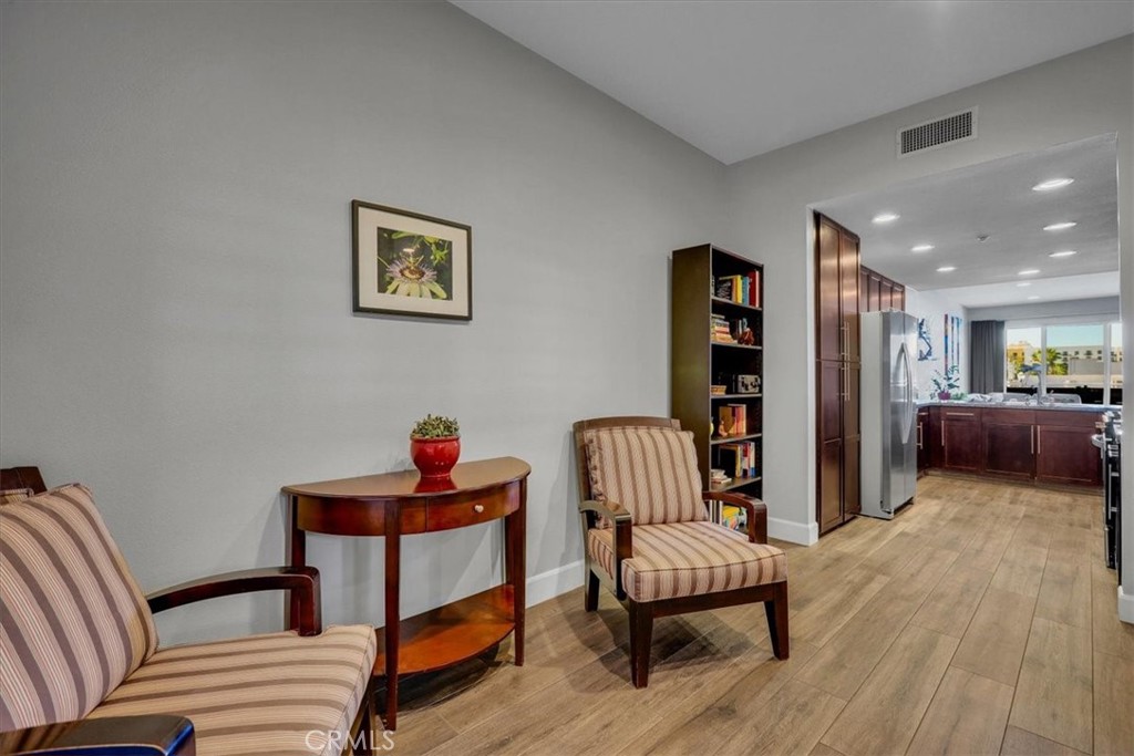 300 East 4th Street, Unit 214 Long Beach, CA 90802 - Photo 27 of 75 a living room with furniture and a wooden floor