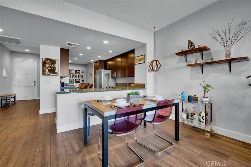 300 East 4th Street, Unit 214 Long Beach, CA 90802 - Photo 37 of 75 a view of a dining room with furniture and wooden floor