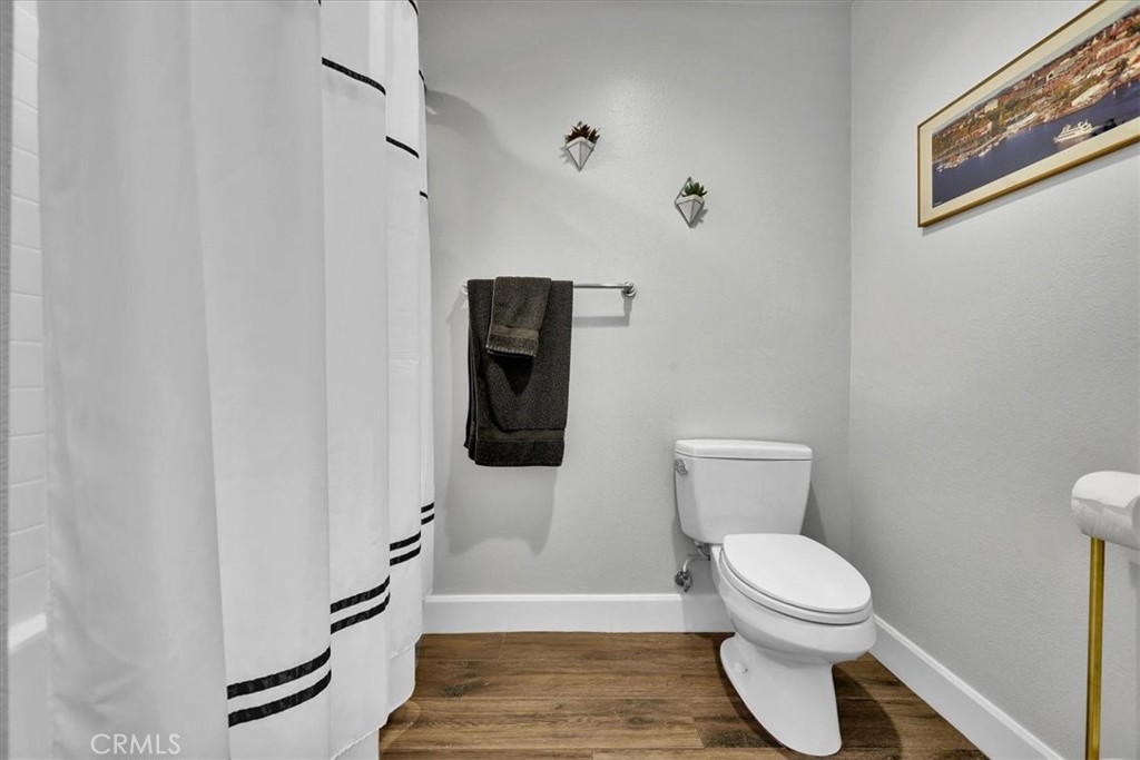 300 East 4th Street, Unit 214 Long Beach, CA 90802 - Photo 43 of 75 a bathroom with a toilet and a shower