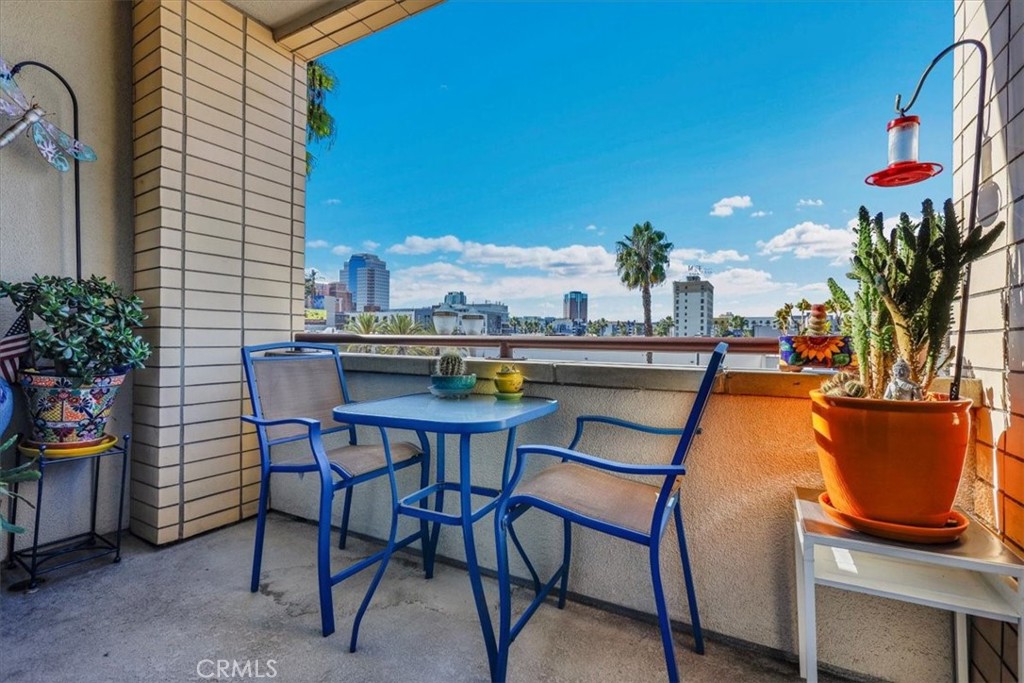 300 East 4th Street, Unit 214 Long Beach, CA 90802 - Photo 52 of 75 a view of a chairs and table in the patio